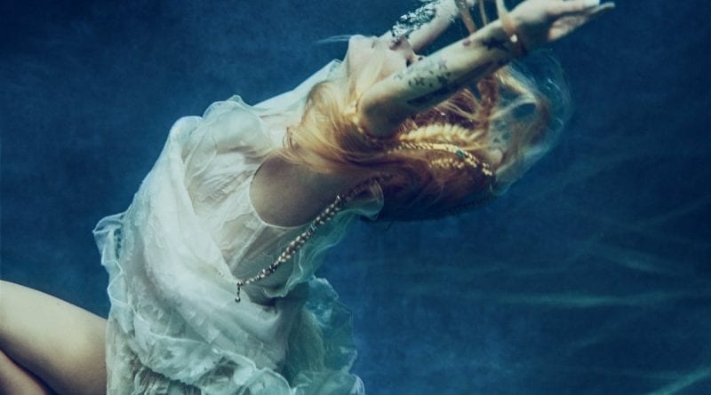 Avril Lavigne - water first image - head above water