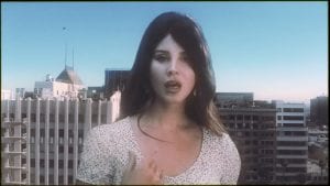 Lana Del Rey Is Larger Than Life In New “Doin’ Time” Music Video